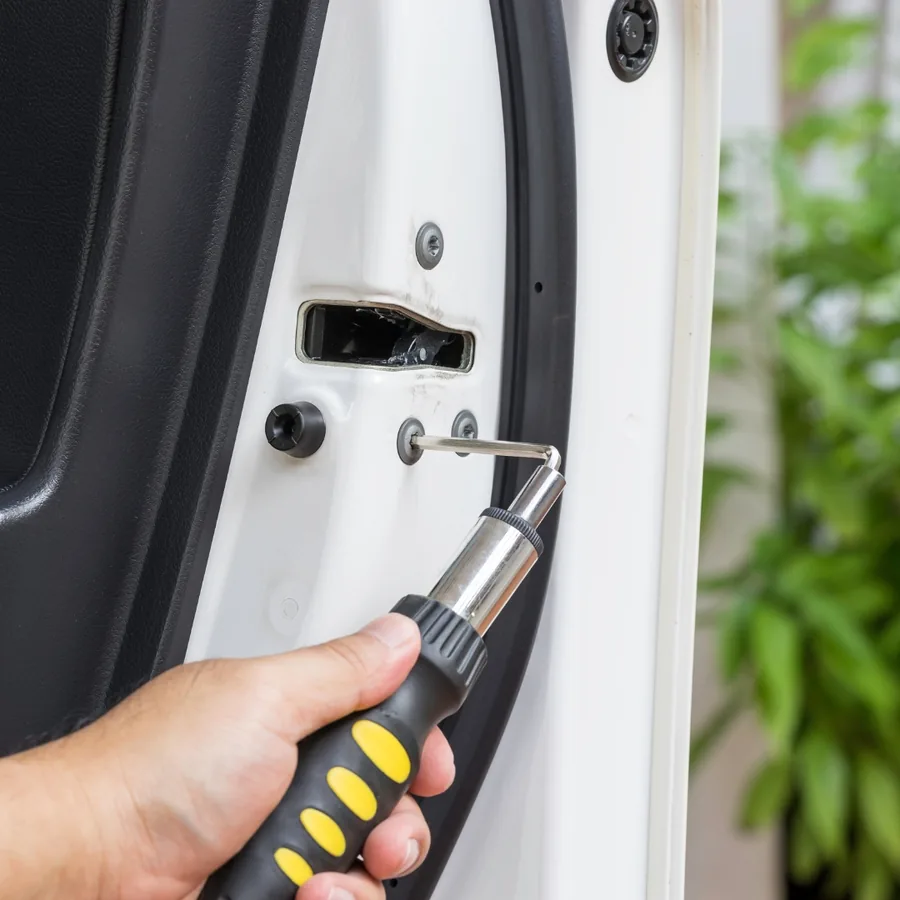Automotive locksmith programming a car key